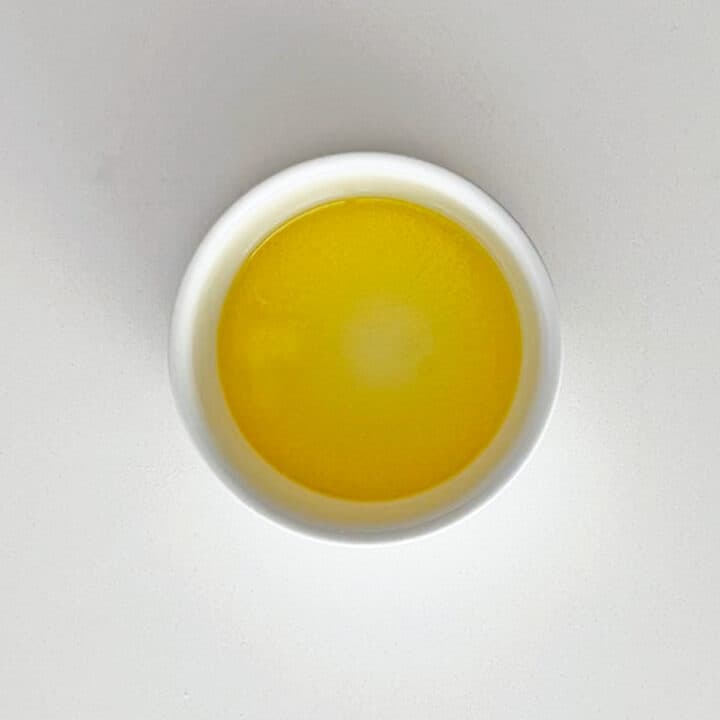 Melted butter in a ramekin.