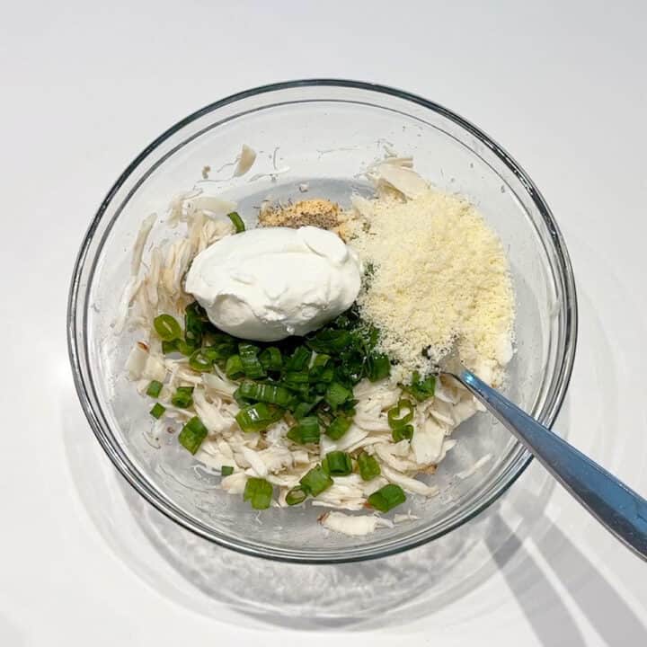 Mixing the filling ingredients in a bowl.