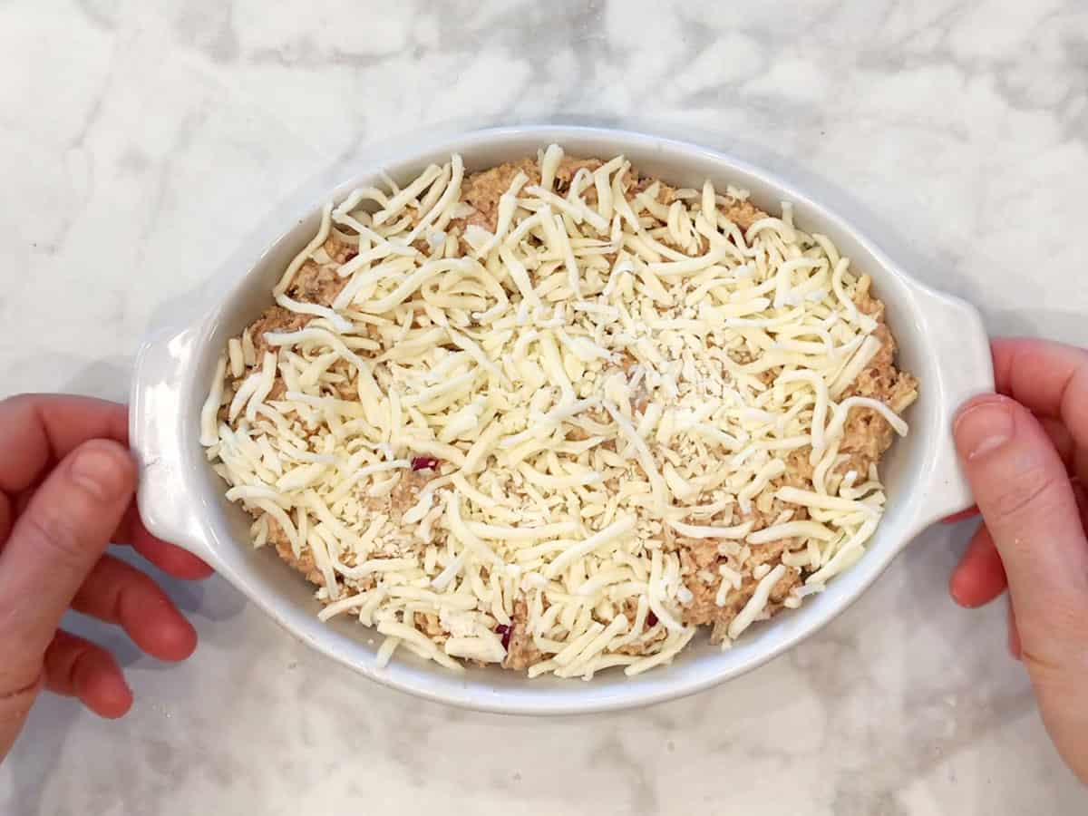 The mixture was transferred to the baking dish and topped with cheese.