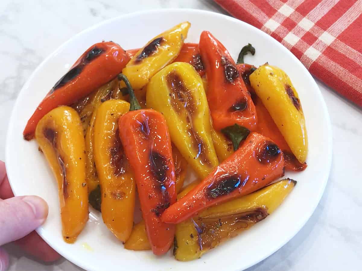 The peppers are served on a white plate.