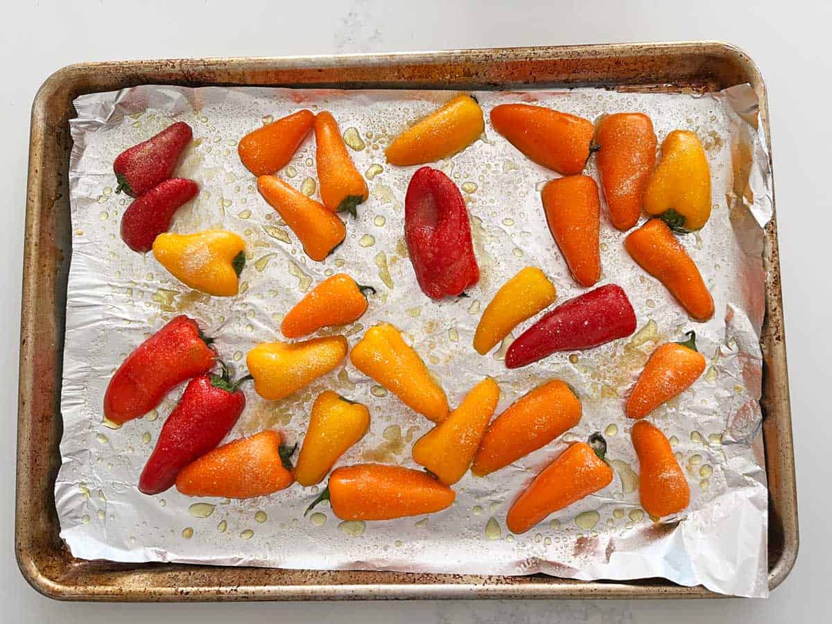 The peppers are on the pan, ready for the oven.