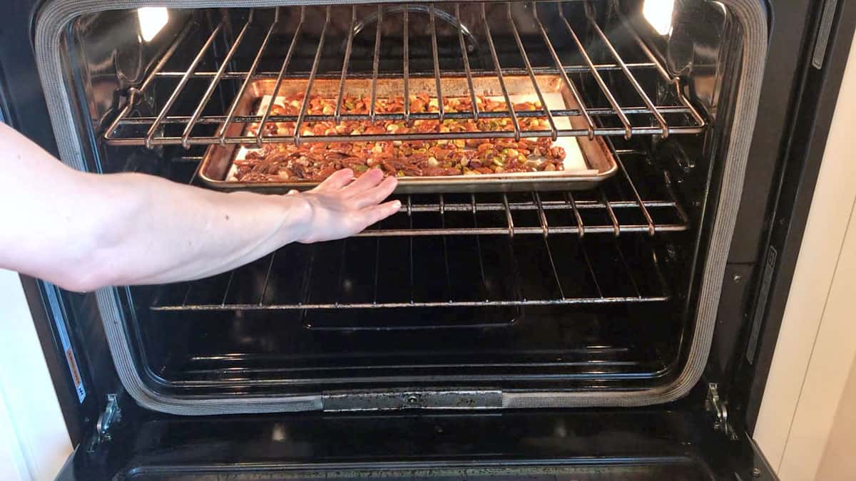 Placing the nuts in the oven.