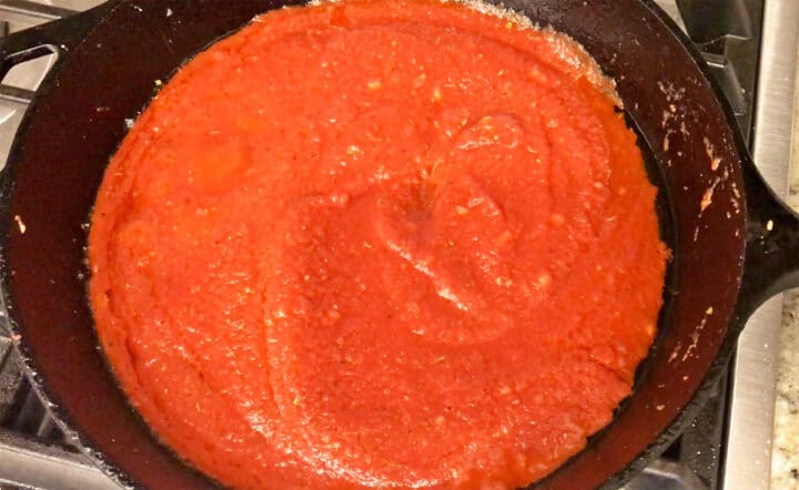 Cooking the tomato sauce.