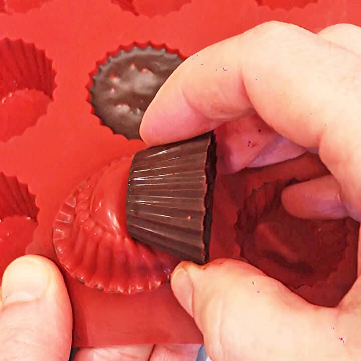 Releasing the chocolate from the mold.