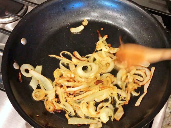Sauteing the onions in a skillet.