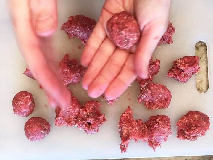 Shaping the meatballs.