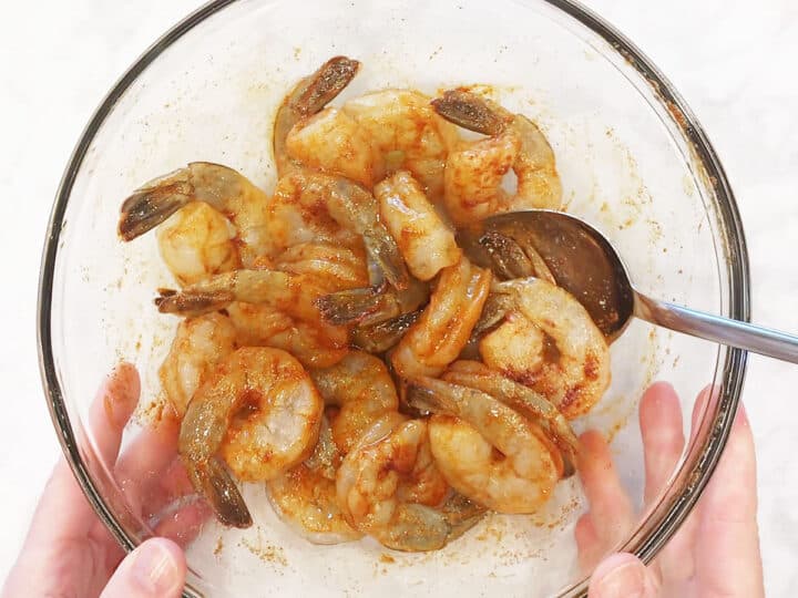 The shrimp were coated in oil and spices.