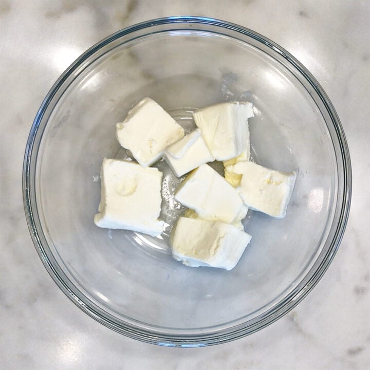 Softened cream cheese in a bowl.