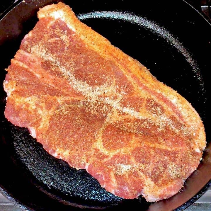 The steak was placed in a cast-iron skillet.