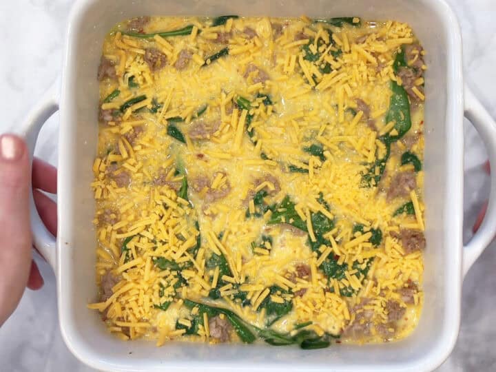 The casserole was topped with cheese and is ready for the oven.
