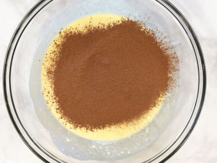 Adding sifted cocoa powder.