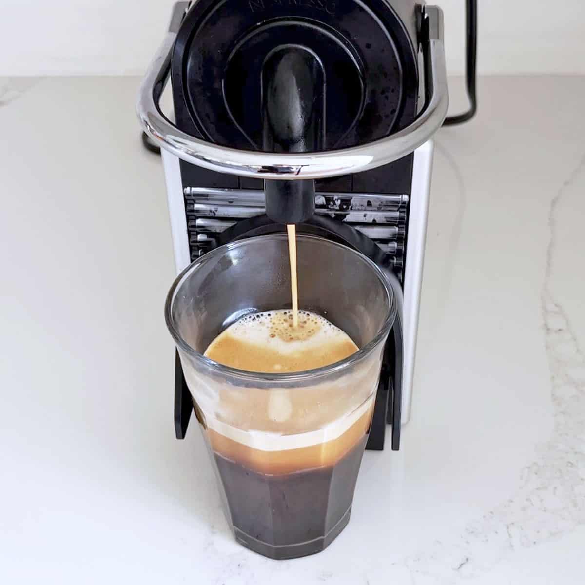 Using a Nespresso machine to make coffee.