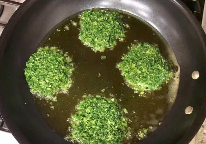 Cooking the fritters in a skillet.