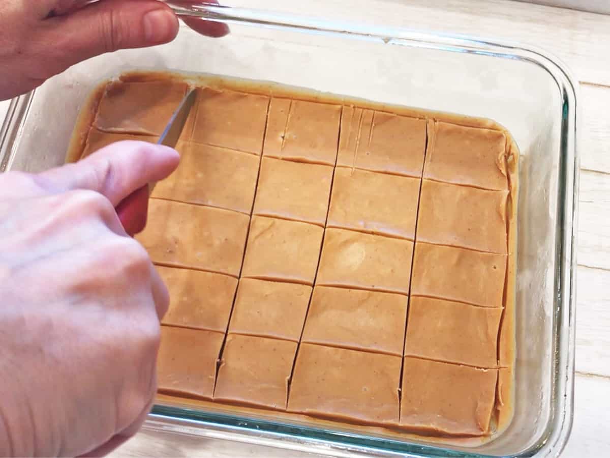 Cutting the fudge into squares.