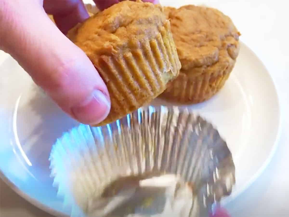Releasing a cupcake from a foil liner.