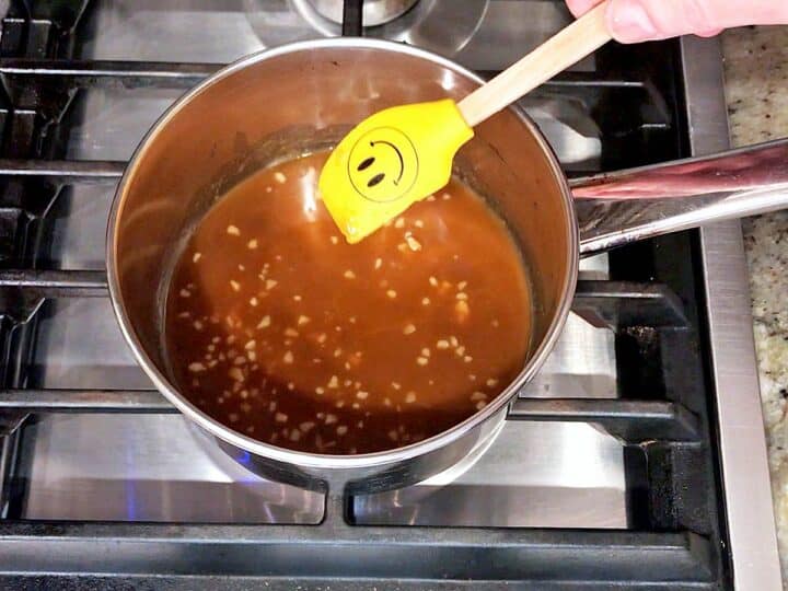Mixing the teriyaki sauce in a saucepan.