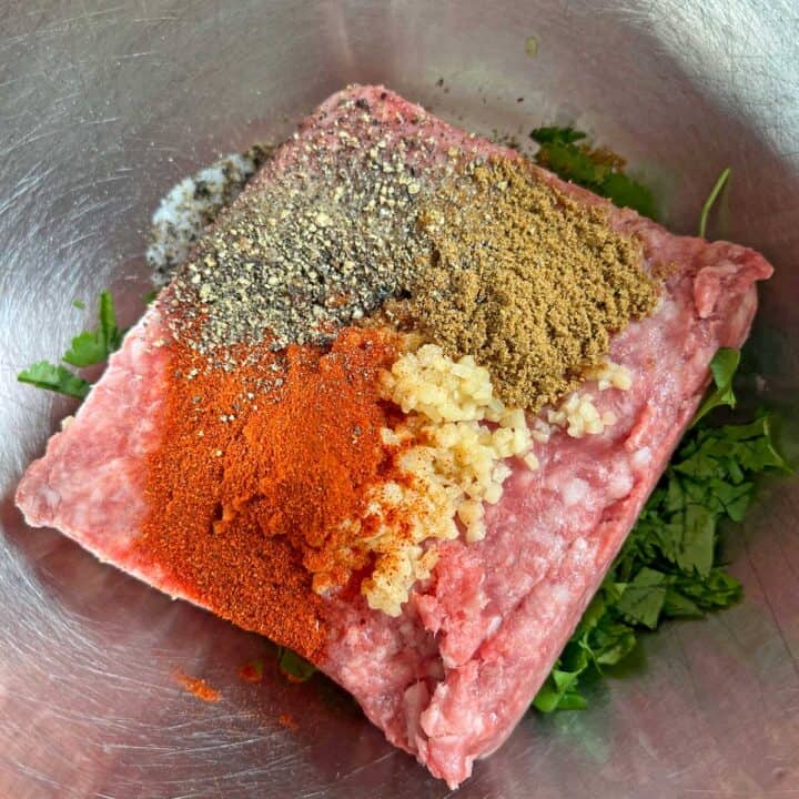 Mixing ground lamb and spices.