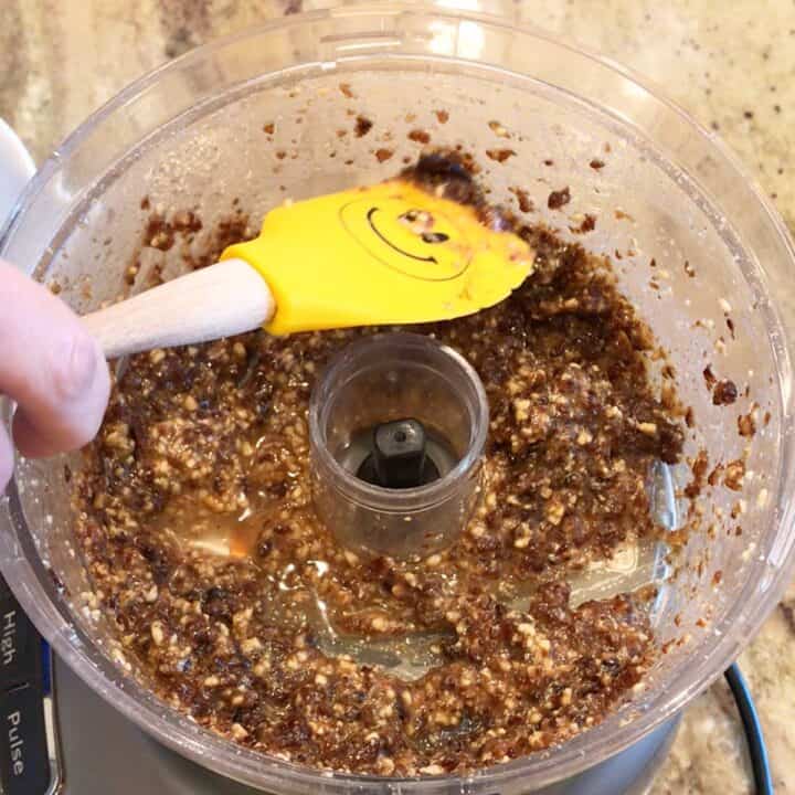 Mixing the charoset with a spatula.