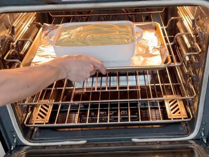 Placing the pan in the oven.