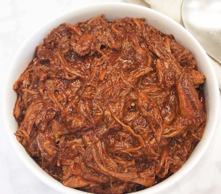 Pulled beef is served in a bowl.