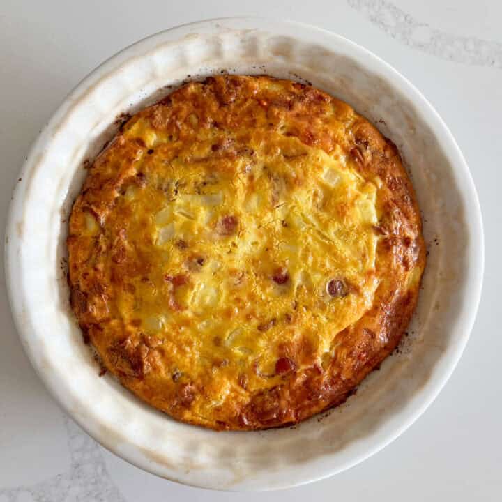 The quiche is fully baked in the pie plate.