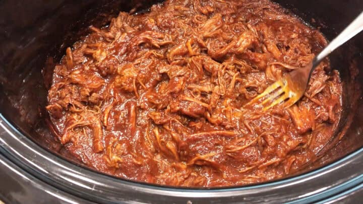 The meat was shredded in the slow cooker pan.