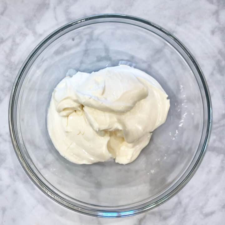 Softened cream cheese in a bowl.