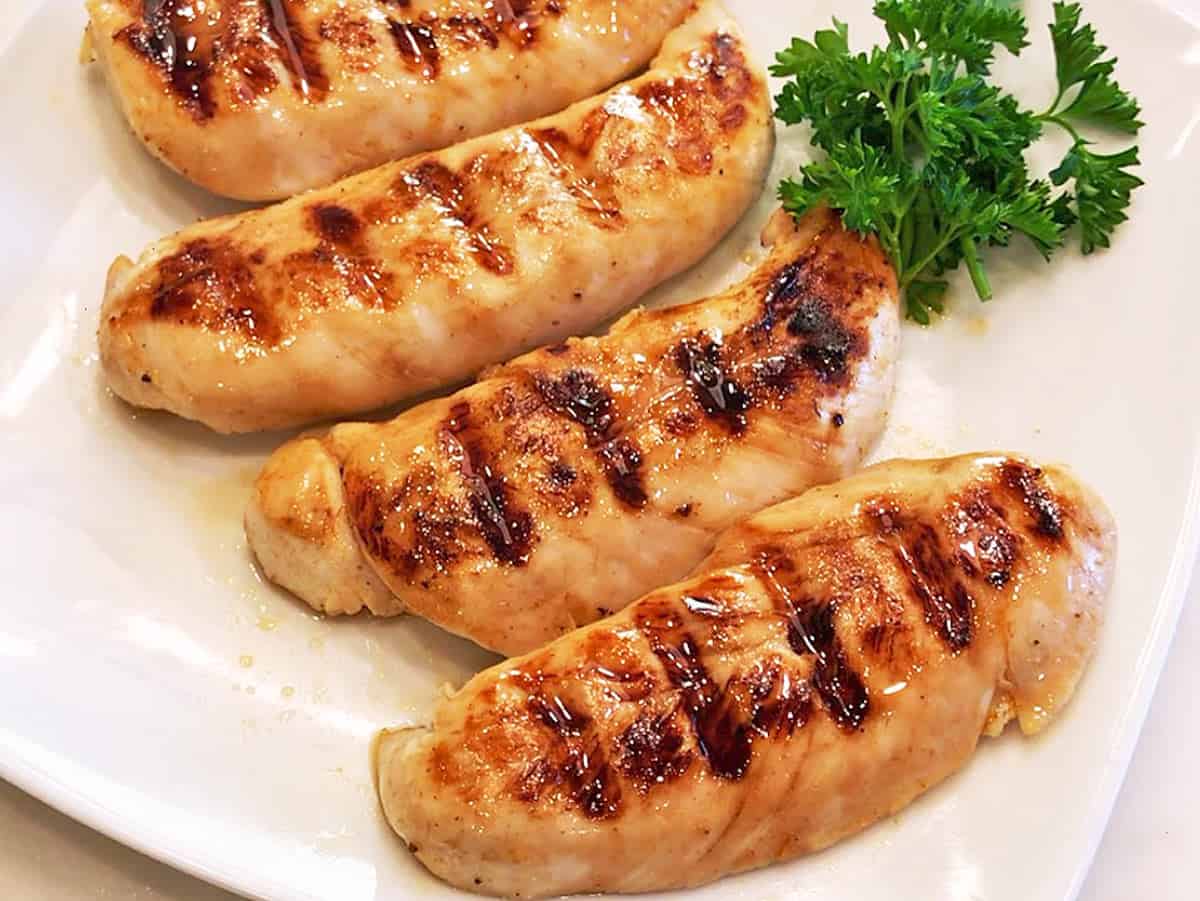 Grilled chicken tenders are served.