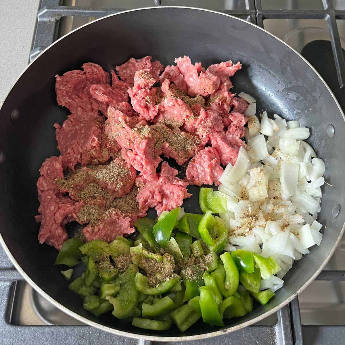 Picadillo ingredients in a skillet.