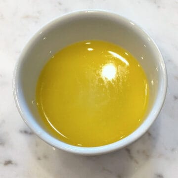 Melted butter in a ramekin.