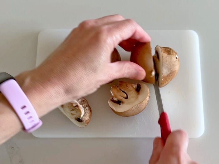 Cutting the mushrooms.