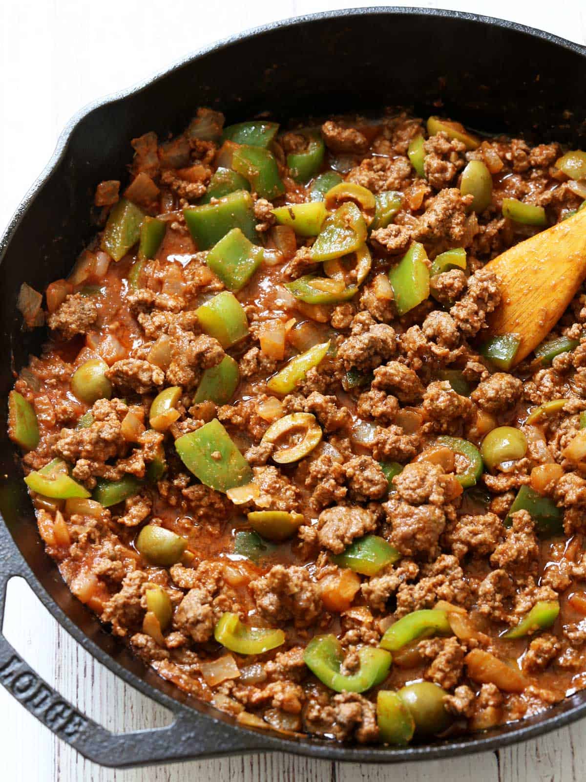 Picadillo in a cast-iron skillet.