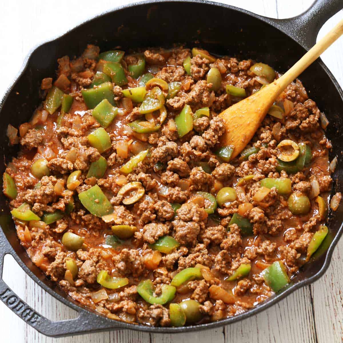 Picadillo in a cast-iron skillet.