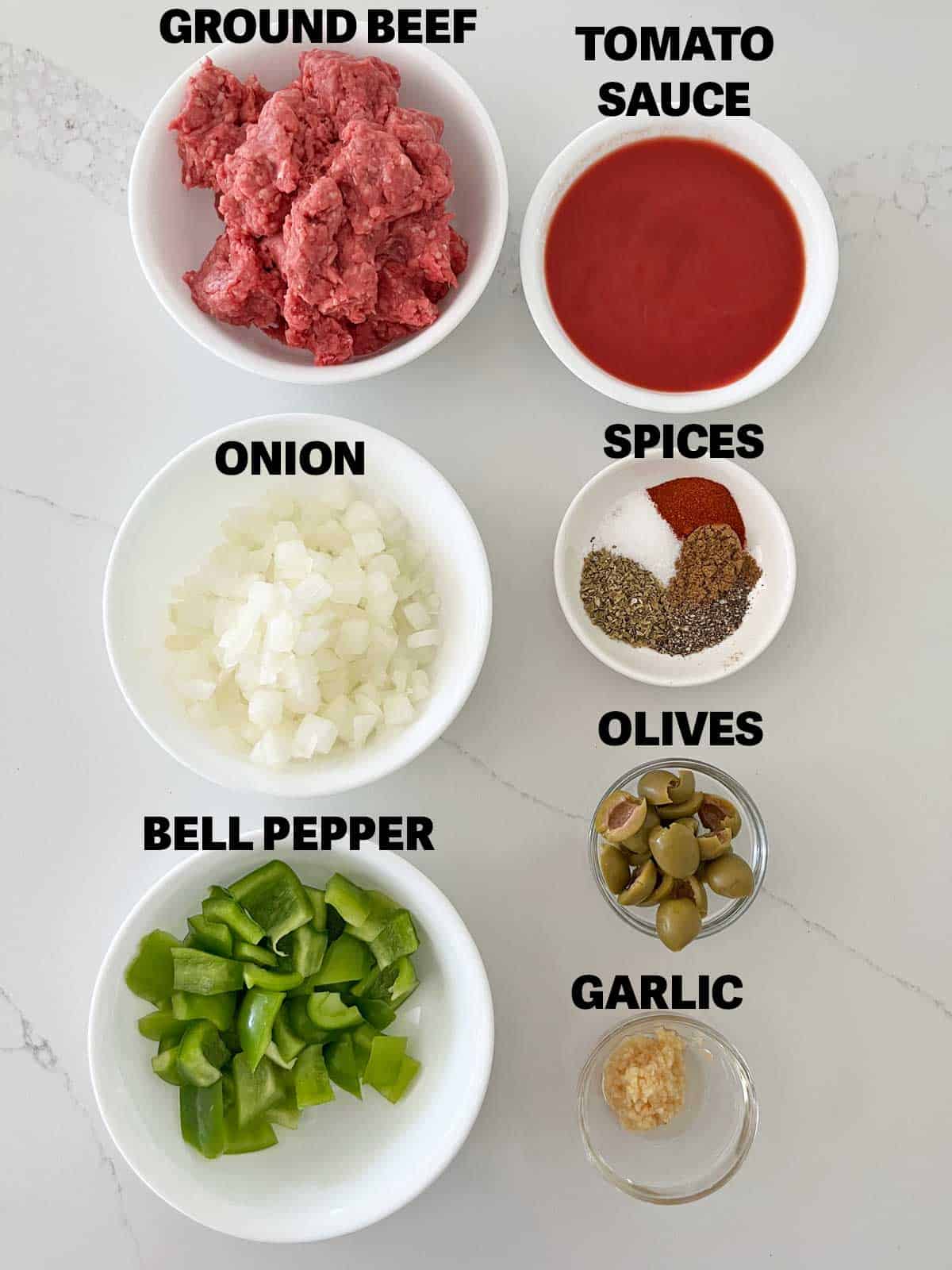 The ingredients needed to make Cuban picadillo.