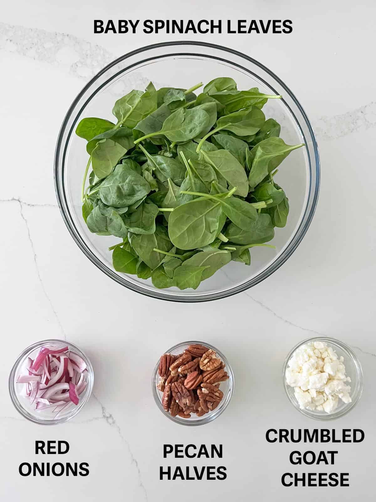 The ingredients needed for a spinach salad.