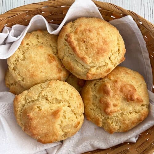 Keto biscuits are served in a basket lined with a white napkin.