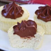 Keto mini cheesecakes are served on a white plate.