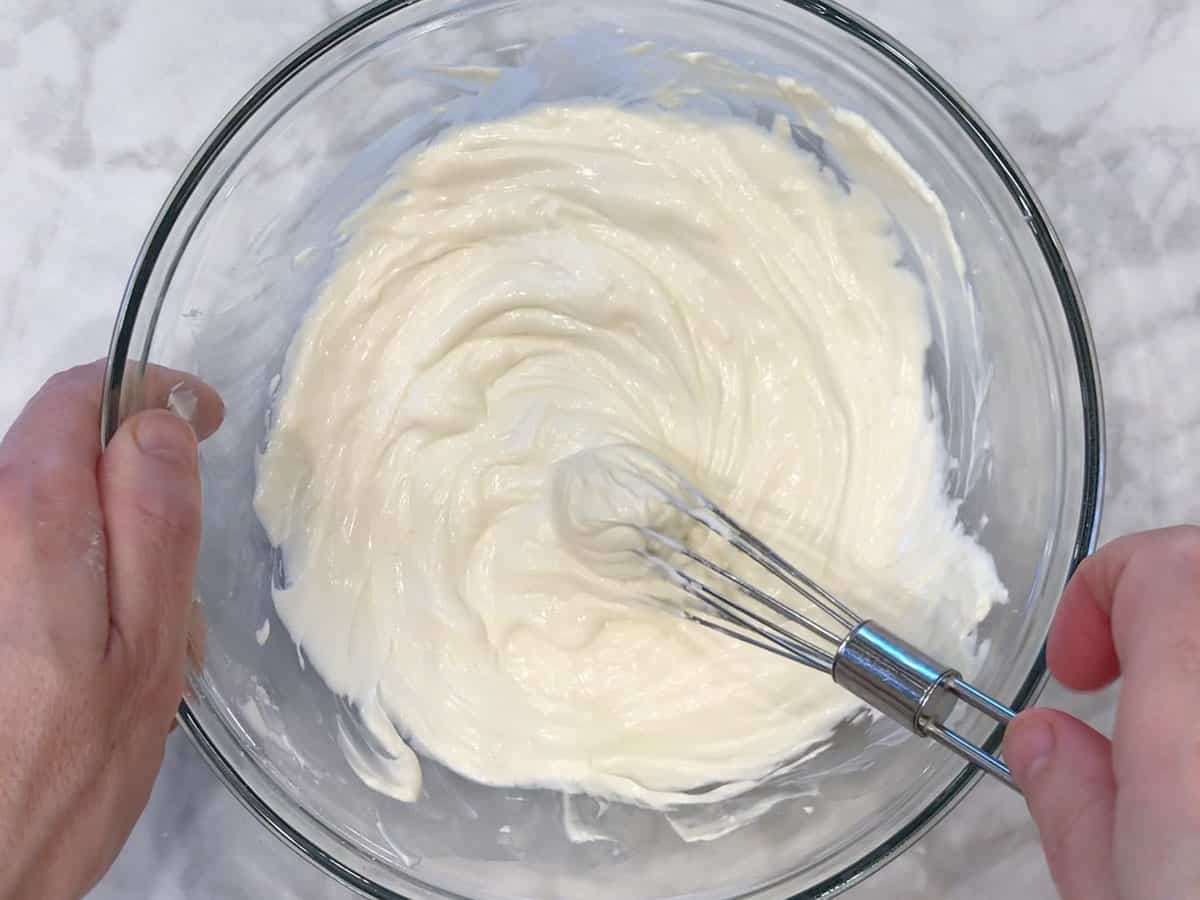 Mixing the ingredients in a bowl.