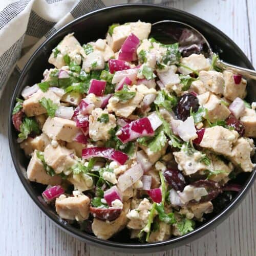 No mayo chicken salad is served in a bowl with a spoon.