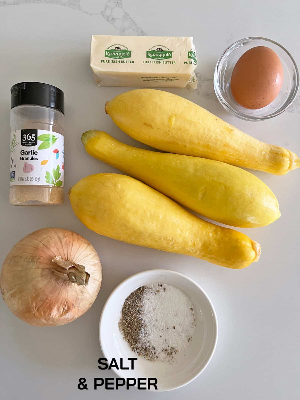 The ingredients needed to make yellow squash fritters.