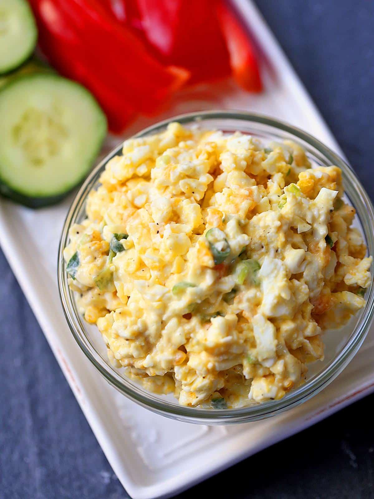 Egg salad is served with fresh-cut veggies.