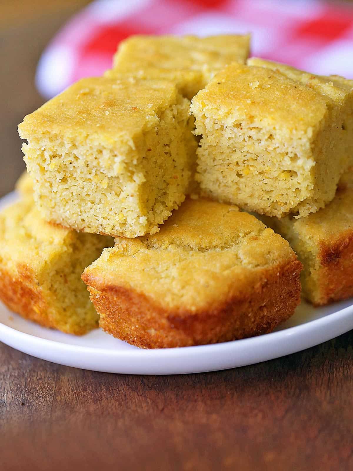 Keto cornbread is served on a white plate.