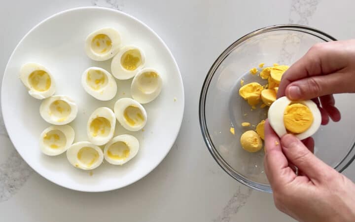 Removing the yolks to a bowl.