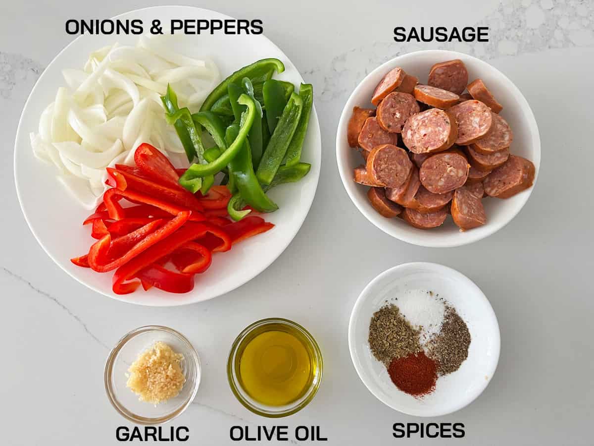 The ingredients needed to make sausage and peppers.