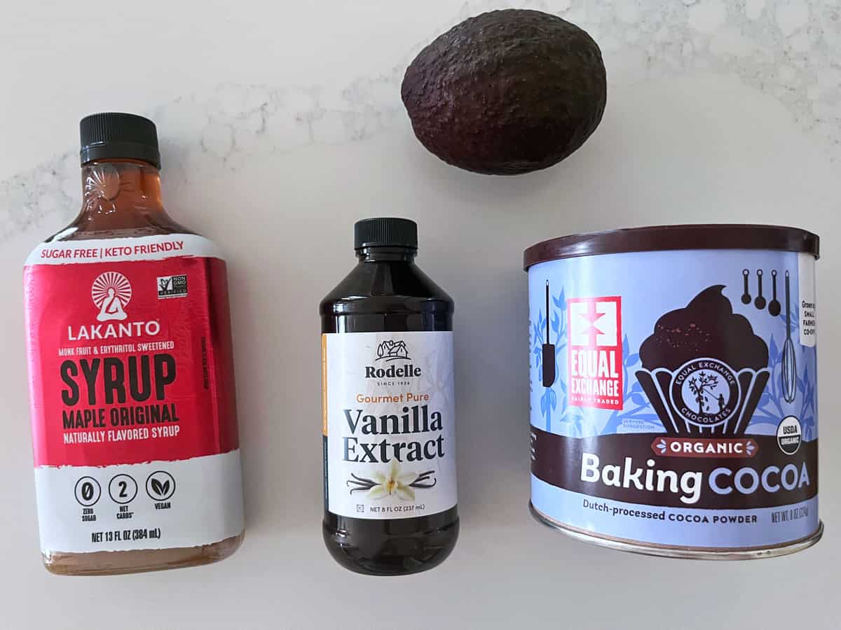The ingredients needed to make avocado chocolate mousse.