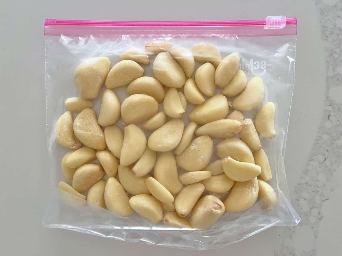 Storing frozen garlic cloves in a Ziploc bag.
