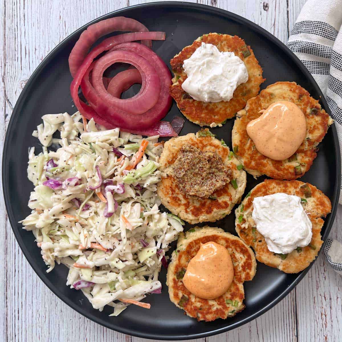 Leftover turkey patties are topped with sriracha mayo, Greek yogurt dip, and mustard.