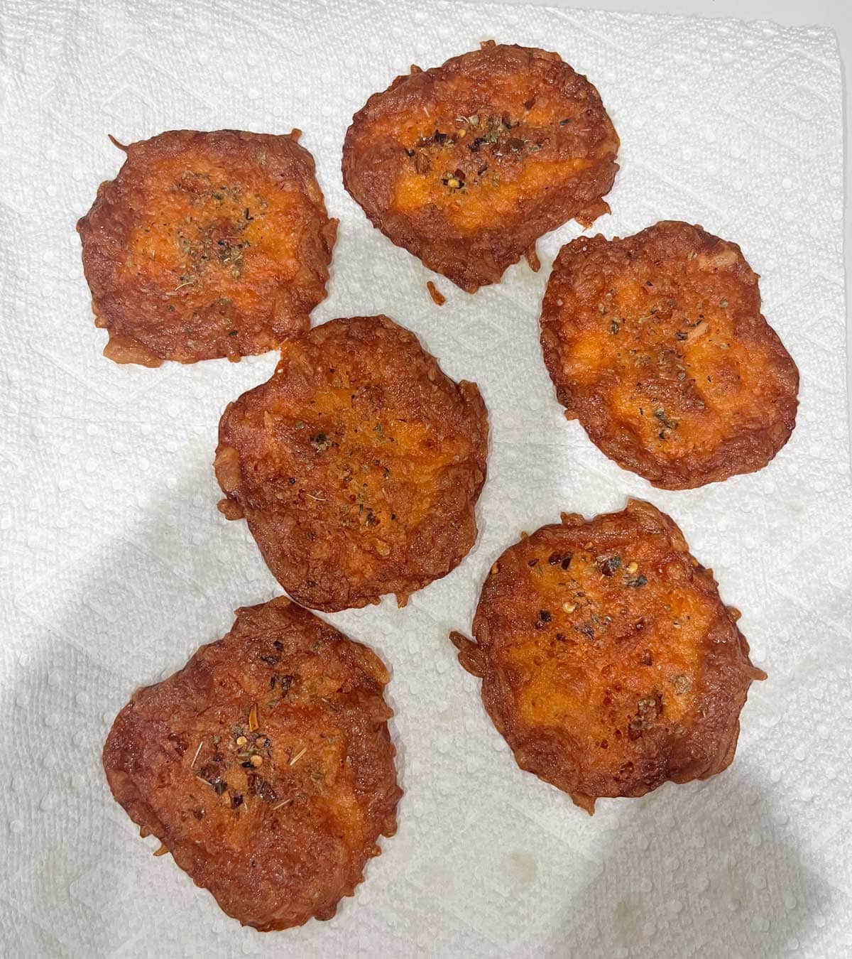 Over-baked cheese chips.