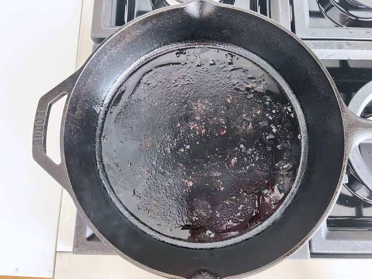 The sausage released fat into the skillet.