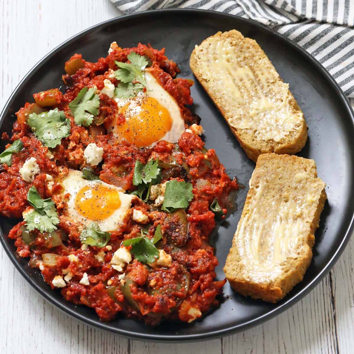 Shakshuka is served with almond flour bread.